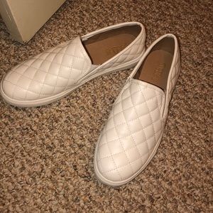 White patterned slip on shoes